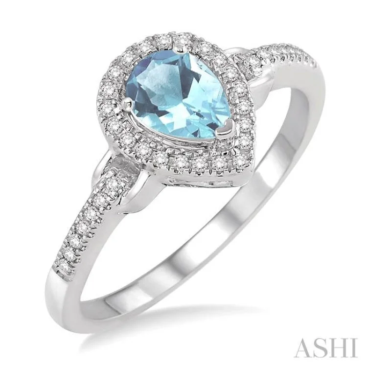 Women’s alternative engagement ring style-7x5 MM Pear Shape Aquamarine and 1/6 Ctw Round Cut Diamond Ring in 10K White gold