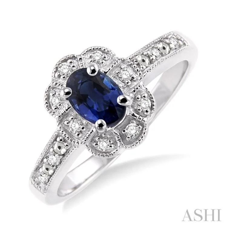 Women’s vintage-inspired engagement ring-6x4 mm Oval Cut Sapphire and 1/20 ctw Single Cut Diamond Ring in Sterling Silver