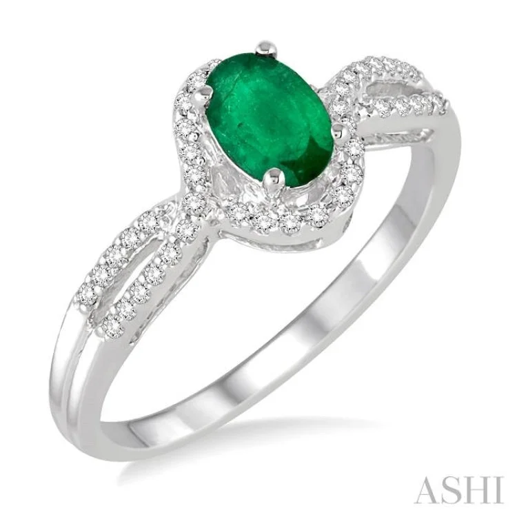 Women’s romantic engagement ring-6x4 MM Oval Cut Emerald and 1/6 Ctw Round Cut Diamond Ring in 10K White Gold