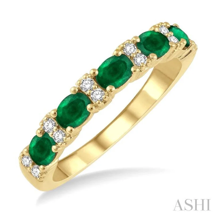 Women’s alternative engagement ring-1/6 Ctw Oval Shape 4x3MM Emerald and Round Cut Diamond Precious Band in 14K Yellow Gold